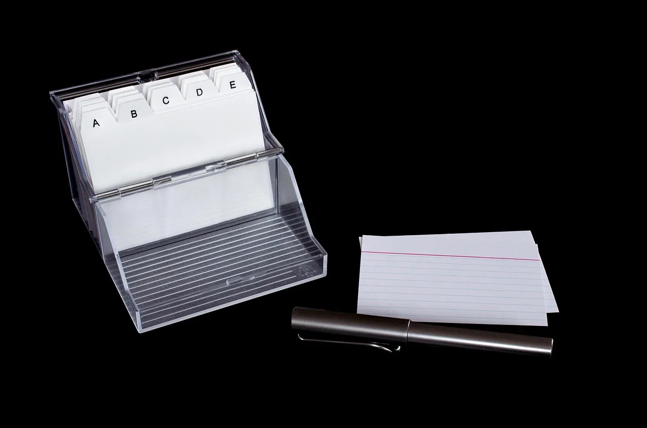A box of index cards, illustrating the spaced-repetition review method used in audio courses